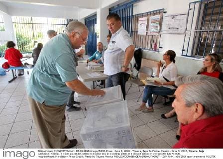 June 5, 2016 - Tijuana, Baja California, Mexico - June 5, 2016, Tijuana, Baja California, Mexico_ A voter places his ballot in a ballot box at a polling place at a private school in the upscale Las Palmas neighborhood. Mandatory Photo Credit: Photo by Tijuana Mexico - ZUMAs44_