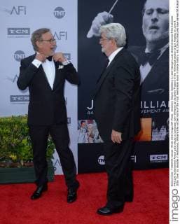 Directors Steven Spielberg (L) and George Lucas attend American Film Institutes 44th Life Achievement Award gala tribute to composer John Williams at the Dolby Theatre in the Hollywood section of Los Angeles on June 9, 2016. Over six decades in Hollywood, Williams has written some of the most memorable music in movie history. His 100-plus features have earned 50 Academy Award nominations (making him the most-nominated living person), winning five times. Williams also received 22 Grammys, seven BAFTAs, five Emmys, four Golden Globes, a Kennedy Center Honor and the National Medal of Arts. And then there are all those iconic themes, the ones everyone in the world knows.  LAP2016060920 JIMxRUYMEN