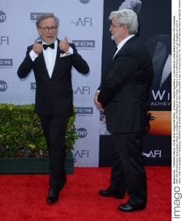 Directors Steven Spielberg (L) and George Lucas attend American Film Institutes 44th Life Achievement Award gala tribute to composer John Williams at the Dolby Theatre in the Hollywood section of Los Angeles on June 9, 2016. Over six decades in Hollywood, Williams has written some of the most memorable music in movie history. His 100-plus features have earned 50 Academy Award nominations (making him the most-nominated living person), winning five times. Williams also received 22 Grammys, seven BAFTAs, five Emmys, four Golden Globes, a Kennedy Center Honor and the National Medal of Arts. And then there are all those iconic themes, the ones everyone in the world knows.  LAP2016060914 JIMxRUYMEN