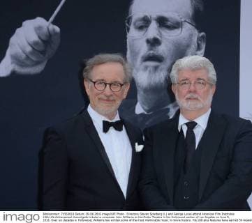 Directors Steven Spielberg (L) and George Lucas attend American Film Institutes 44th Life Achievement Award gala tribute to composer John Williams at the Dolby Theatre in the Hollywood section of Los Angeles on June 9, 2016. Over six decades in Hollywood, Williams has written some of the most memorable music in movie history. His 100-plus features have earned 50 Academy Award nominations (making him the most-nominated living person), winning five times. Williams also received 22 Grammys, seven BAFTAs, five Emmys, four Golden Globes, a Kennedy Center Honor and the National Medal of Arts. And then there are all those iconic themes, the ones everyone in the world knows.  LAP2016060918 JIMxRUYMEN