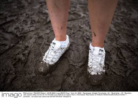 June 12, 2016 - Manchester, Greater Manchester, UK - Manchester , UK . Revellers with muddy white trainers at the Parklife music festival at Heaton Park in Manchester Manchester UK  - ZUMAl94_