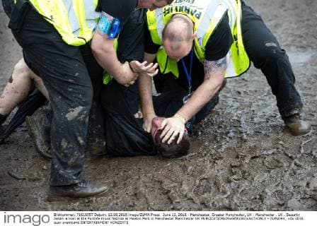 June 12, 2016 - Manchester, Greater Manchester, UK - Manchester , UK . Security detain a man at the Parklife music festival at Heaton Park in Manchester Manchester UK  - ZUMAl94_