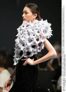 A model presents a creation designed by graduates of Beijing Institute of Fashion Technology in Beijing, capital of China, June 14, 2016. ) (ry) CHINA-BEIJING-FASHION SHOW(CN) LixJianbo 