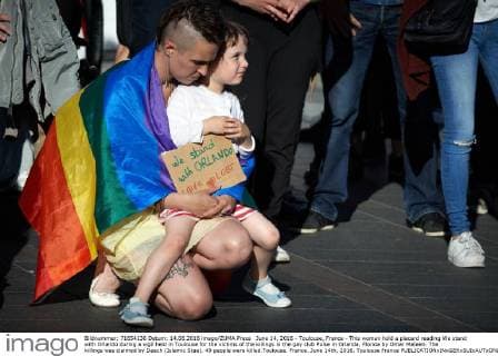 June 14, 2016 - Toulouse, France - This woman hold a placard reading We stand with Orlando during a vigil held in Toulouse for the victims of the killings in the gay club Pulse in Orlanda, Florida by Omar Mateen. The killings was claimed by Daech (Islamic Stae). 49 people were killed.Toulouse. France. June 14th, 2016. Toulouse France  - ZUMAn230