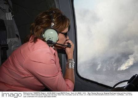 June 16, 2016 - U.S. - New Mexico Governor Susana Martinez looks out the window of a Black Hawk helicopter flying over the Dog Head Fire, Thursday June 16, 2016. U.S. - ZUMAab1_