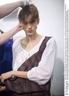 MILAN, June 19, 2016 -- A model has his hair made backstage before Vivienne Westwood men s Spring-Summer 2016-2017 collection, part of the Milan Fashion Week in Milan, Italy, on June 19, 2016. ) ITALY-MILAN-FASHION WEEK-MEN-VIVIENNE WESTWOOD-BACKSTAGE JinxYu 