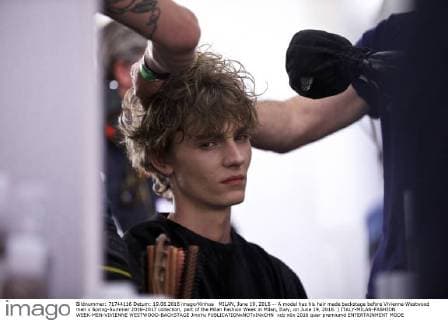 MILAN, June 19, 2016 -- A model has his hair made backstage before Vivienne Westwood men s Spring-Summer 2016-2017 collection, part of the Milan Fashion Week in Milan, Italy, on June 19, 2016. ) ITALY-MILAN-FASHION WEEK-MEN-VIVIENNE WESTWOOD-BACKSTAGE JinxYu 