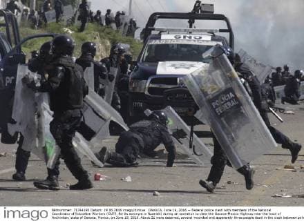 OAXACA, June 19, 2016 -- Federal police clash with members of the National Coordinator of Education Workers (CNTE, for its acronym in Spanish) during an operation to clear the Oaxaca-Mexico Highway near the town of Nochixtlan, state of Oaxaca, Mexico, on June 19, 2016. About 21 were detained, several wounded and apparently three people dead in the clash between police and members of the CNTE, according to the first official reports. ) (vf) (ah) MEXICO-OAXACA-SOCIETY-PROTEST MaxxNunez 