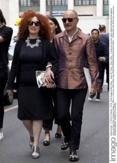 June 19, 2016 - Milan, Italy - A man and woman walks before Salvatore Ferragamo show at Milan Men s Fashion Week in Milan on 19 June, 2016 Milan Italy  - ZUMAn230