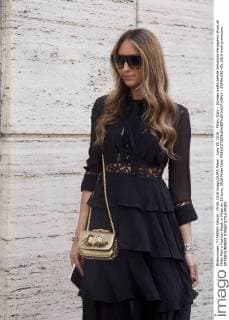 June 19, 2016 - Milan, Italy - Woman walks before Salvatore Ferragamo show at Milan Men s Fashion Week in Milan on 19 June, 2016 Milan Italy  - ZUMAn230