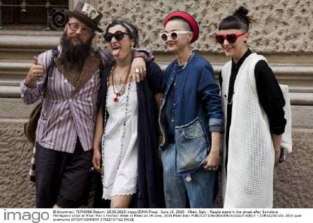 June 19, 2016 - Milan, Italy - People stand in the street after Salvatore Ferragamo show at Milan Men s Fashion Week in Milan on 19 June, 2016 Milan Italy  - ZUMAn230