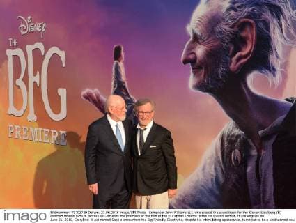 Composer John Williams (L), who scored the soundtrack for the Steven Spielberg (R) directed motion picture fantasy BFG attends the premiere of the film at the El Capitan Theatre in the Hollywood section of Los Angeles on June 21, 2016. Storyline: A girl named Sophie encounters the Big Friendly Giant who, despite his intimidating appearance, turns out to be a kindhearted soul who is considered an outcast by the other giants because, unlike them, he refuses to eat children.  LAP2016062121 JIMxRUYMEN