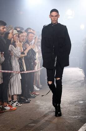A model takes to the catwalk during the presentation of Julius show as part of the Spring-Summer 2017 Fashion Week in Paris on June 22, 2016.  PAR20160623101 MAYAxVIDON-WHITE