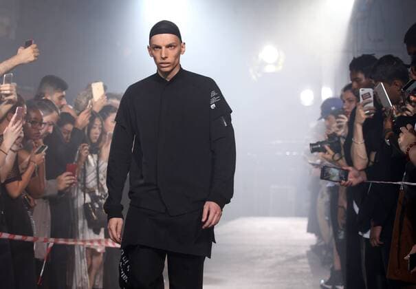 A model takes to the catwalk during the presentation of Julius show as part of the Spring-Summer 2017 Fashion Week in Paris on June 22, 2016.  PAR20160623107 MAYAxVIDON-WHITE