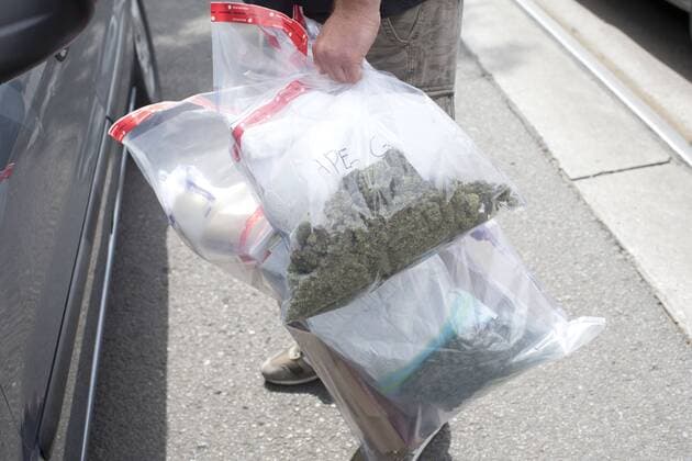 June 23, 2016 - Toronto, Ontario, Canada - TORONTO, ON- JUNE 23:.Police removed marijuana and cannabis oil following a raid where three people were arrested at Cannabis Culture on Queen Street West in Toronto Thursday afternoon.. Toronto Canada  - ZUMAt14_