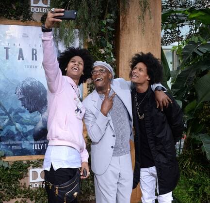 Cast member Samuel L. Jackson (C) takes a selfie with the Les Twins during the premiere of the motion picture adventure film The Legend of Tarzan at the Dolby Theatre in the Hollywood section of Los Angeles on June 27, 2016. Storyline: Tarzan, having acclimated to life in London, is called back to his former home in the jungle to investigate the activities at a mining encampment.  LAP2016062734 JIMxRUYMEN