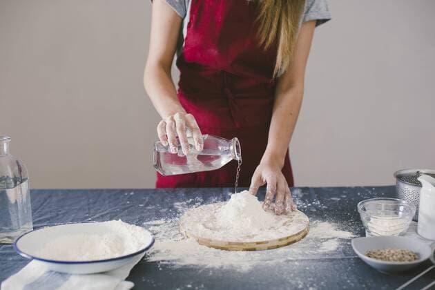 Woman preparing home made bread model released Symbolfoto property released  EBSF001389