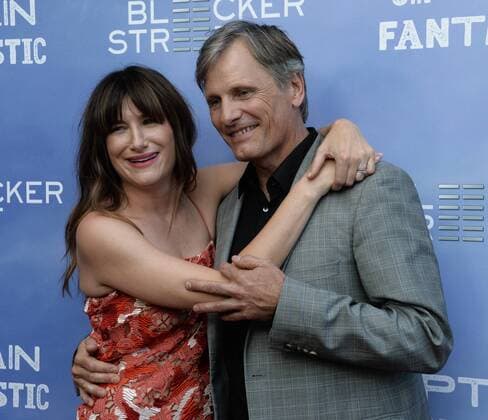 Captain Fantastic Premiere in Hollywood Cast members Kathryn Hahn (L) and Viggo Mortensen attend the premiere of the motion picture drama Captain Fantastic at the Harmony Gold Theatre in the Hollywood section of Los Angeles on June 26, 2016. Storyline: In the forests of the Pacific Northwest, a father devoted to raising his six kids with a rigorous physical and intellectual education is forced to leave his paradise and enter the world, challenging his idea of what it means to be a parent.  LAP2016062827 JIMxRUYMEN