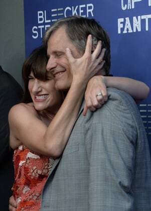 Cast members Kathryn Hahn (L) and Viggo Mortensen attend the premiere of the motion picture drama Captain Fantastic at the Harmony Gold Theatre in the Hollywood section of Los Angeles on June 26, 2016. Storyline: In the forests of the Pacific Northwest, a father devoted to raising his six kids with a rigorous physical and intellectual education is forced to leave his paradise and enter the world, challenging his idea of what it means to be a parent.  LAP2016062825 JIMxRUYMEN