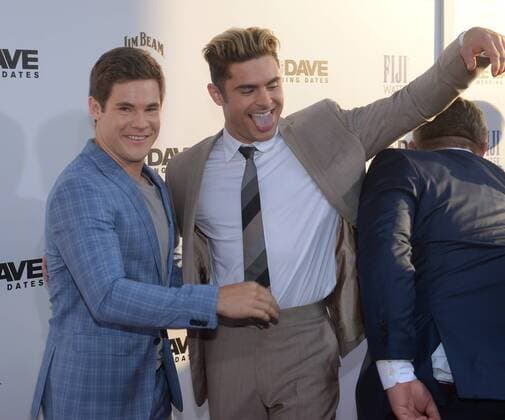Cast members Adan Devine (L) and Zac Efron attend the premiere of the motion picture comedy Mike and Dave Need Wedding Dates at the ArcLight Cinema Dome in the Hollywood section of Los Angeles on June 29, 2016. Storyline: Hard-partying brothers place an online ad to find the perfect dates for their sister s Hawaiian wedding. Hoping for a wild getaway, the boys instead find themselves outsmarted and out-partied by the uncontrollable duo.  LAP2016062921 JIMxRUYMEN