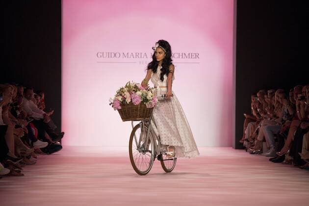 June 29, 2016 - Berlin, Germany - A model rides the runway with a bike at the Guido Maria Kretschmer show during the Mercedes-Benz Fashion Week Berlin Spring Summer 2017 at Erika Hess Eisstadion in Berlin, Germany on June 29, 2016. Berlin Germany  - ZUMAn230