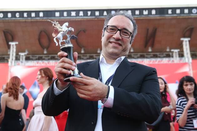 MOSCOW, RUSSIA - JUNE 30, 2016: Director Reza Mirkarimi with the Golden George award main prize for the best film for his film Daughter at the closing of the 38th Moscow International Film Festival. Vyacheslav Prokofyev TASS  TS0288A8