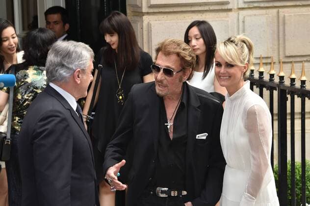 Singer Johnny Hallyday and his wife Laeticia leave the Christian Dior Haute Couture Fall Winter 2016-2017 show as part of Paris Fashion Week in Paris, France. PEOPLE: Fashion Week Modeschau Christian Dior - Fashion Week de Paris - 04 07 2016 LionelUrman 