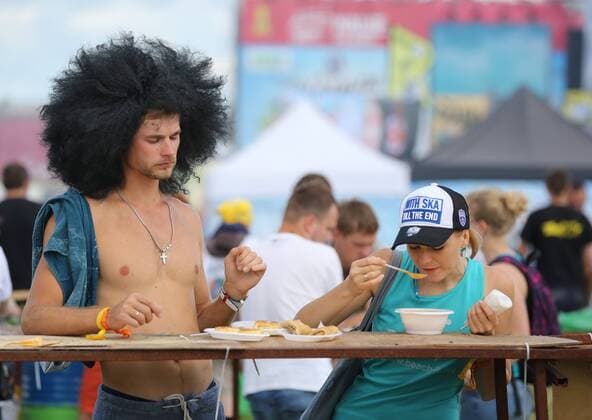 TVER REGION, RUSSIA - JULY 9, 2016: People attend the 16th Nashestvie (Invasion) rock music festival in the village of Bolshoye Zavidovo. Alexander Ryumin TASS  TS02970B