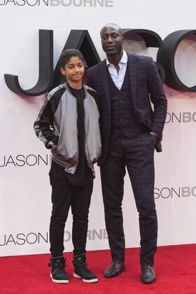 London, UK. 11 July 2016. Fashion designer Ozwald Boateng OBE with son Oscar Boateng. Red carpet arrivals for the European Premiere of the Universal movie Jason Bourne (2016) in London s Leicester Square. European Premiere of Jason Bourne, London, UK 