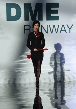 MOSCOW REGION, RUSSIA - JULY 12, 2016: A VIM Airlines employee showcases clothes during the 2016 DME Runway fashion show marking International Flight Attendant Day at Domodedovo International Airport. Mikhail Metzel TASS  TS029C25