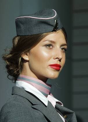 MOSCOW REGION, RUSSIA - JULY 12, 2016: A Belavia Belarusian Airlines employee showcases clothes during the 2016 DME Runway fashion show marking International Flight Attendant Day at Domodedovo International Airport. Mikhail Metzel TASS  TS029C29