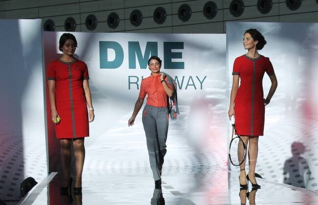 MOSCOW REGION, RUSSIA - JULY 12, 2016: Red Wings Airlines employees showcase clothes during the 2016 DME Runway fashion show marking International Flight Attendant Day at Domodedovo International Airport. Mikhail Metzel TASS  TS029C2C