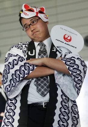 MOSCOW REGION, RUSSIA - JULY 12, 2016: A Japan Airlines employee showcases clothes during the 2016 DME Runway fashion show marking International Flight Attendant Day at Domodedovo International Airport. Mikhail Metzel TASS  TS029C43