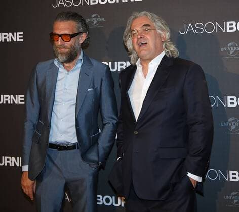 Vincent Cassel (L) and Paul Greengrass attend the French premiere of the film Jason Bourne in Paris on July 12, 2016.  PAR20160712718 DAVIDxSILPA