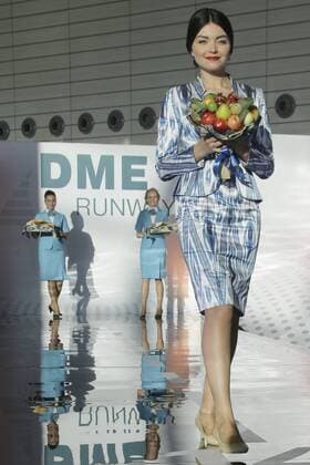 MOSCOW REGION, RUSSIA - JULY 12, 2016: Uzbekistan Airways employees showcase clothes during the 2016 DME Runway fashion show marking International Flight Attendant Day at Domodedovo International Airport. Mikhail Metzel TASS  TS029C68