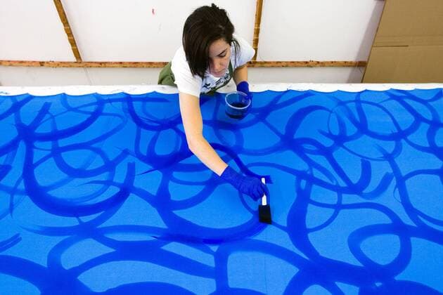 Aug. 25, 2010 - Montreal, QC, Canada - MONTREAL, QUE.: AUGUST 25, 2010 -- Costume maker MÂ»lanie Gresselin paints fabric for a costume inside the textiles workshop at the Cirque du Soleil headquarters in Montreal on Wednesday, August 25, 2010. (Dario Ayala CALGARY HERALD) FOR POSTMEDIA NEWS WEEKLY FEATURES PACKAGES SEPTEMBER 13, 2010. FEAT-CIRQUE - ZUMAw51_