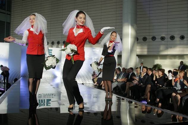MOSCOW REGION, RUSSIA - JULY 12, 2016: Rusline employees showcase clothes during the 2016 DME Runway fashion show marking International Flight Attendant Day at Domodedovo International Airport. Mikhail Metzel TASS  TS029C6B