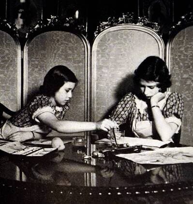 Photograph of Princess Elizabeth (1926-) and Margaret (1930-2002) in the schoolroom on the top floor of Royal Lodge. Dated 20th Century WorldxHistoryxArchive