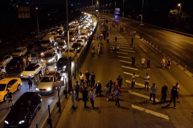 People gather at Kadikoy City and Bosphorus Bridge Road of Istanbul. A group of Turkey s armed forces said on Friday they had taken power in the country to protect the democratic order and to maintain human rights. Turkish people on Turkish tanks.(Murat Düzyol - Depo Photos)  15438031
