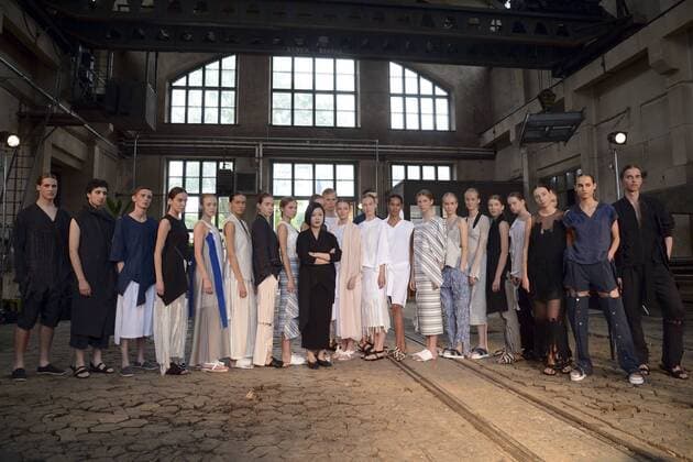 HELSINKI, July 22, 2016 -- South Korean Designer Sujinn Kim(C) poses with models during the Helsinki Fashion Week in Helsinki, Finland, on July 22, 2016. The first two fashion shows of the Helsinki Fashion Week 2016 were held on Friday at the original site of the Finnish State Aircraft Factory, which was built in 1928. )(yy) FINLAND-HELSINKI-CATWALK SHOW-OLD AIRCRAFT FACTORY SergeixStepanov 