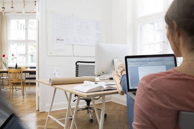 Woman using laptop in office model released Symbolfoto property released  FKF001852