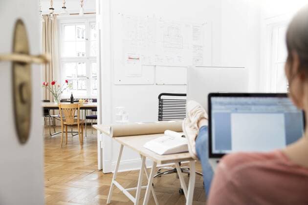 Woman using laptop in office model released Symbolfoto property released  FKF001854