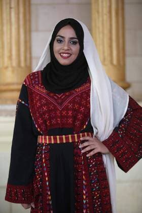 (160725) -- JENIN, July 25, 2016 -- A Palestinian model displays a traditional Palestinian dress during a fashion show in celebration of Palestinian Traditional Dress and Heritage Day at Haddad village near the West Bank city of Jenin, July 25, 2016. ) MIDEAST-JENIN-HERITAGE DAY AymanxNobani 