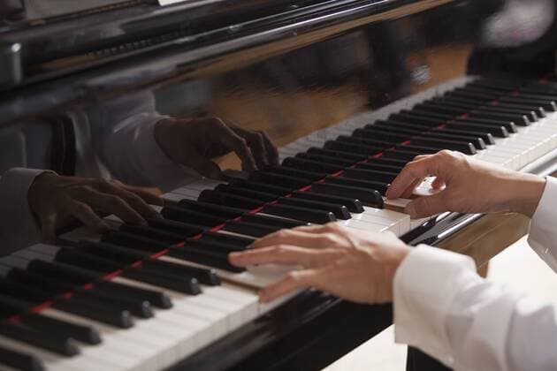 Close up of a pianist s hands, playing on a grand piano. Close up of a pianist s hands, playing on a grand piano.  21480