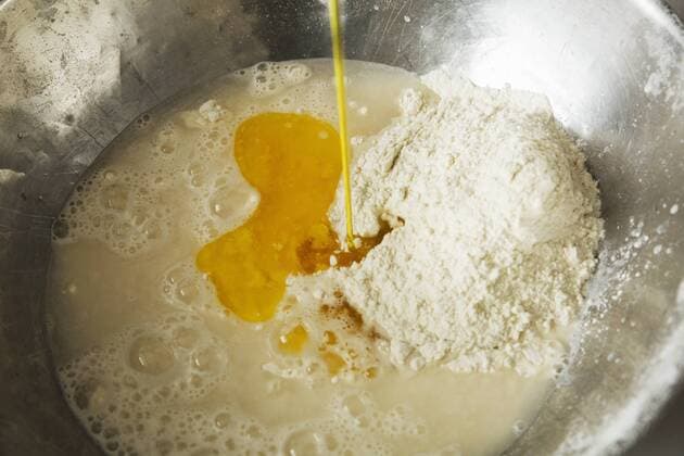 Close up of bread dough in a metal mixing bowl, flour, water and eggs. Close up of bread dough in a metal mixing bowl, flour, water and eggs.  21758