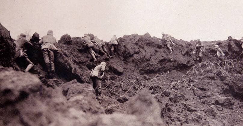 World War One German infantry advance from a trench under allied gunfire. 1915 WorldxHistoryxArchive
