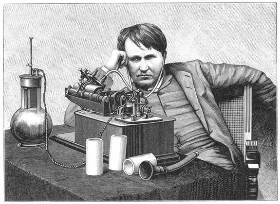 Thomas Alva Edison (1847-1931) American inventor, listening to a recording on his phonograph. This is an electric model powered by a bichromate cell (left), a form of wet battery. Engraving c1895. WHA  !ACHTUNG AUFNAHMEDATUM GESCHÄTZT! Copyright: WHA UnitedArchives0460001551