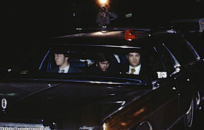 July 27, 2016 - (File Photo) - A federal judge on Wednesday granted John Hinckley, Jr., who was found not guilty by reason of insanity in the attempted assassination of President Ronald Reagan, a full-time release from St. Elizabeth s Hospital in Washington, D.C., PICTURED: March 30, 1981 - Washington, District of Columbia, U.S. - JOHN HINCKEY JR. sits in the middle of the bench seat of the station surrounded by FBI agents as he departs the United States District for the District of Columbia after being arraigned and charged with the attempted assassination of President Ronald Reagan. Washington U.S. - ZUMAr142