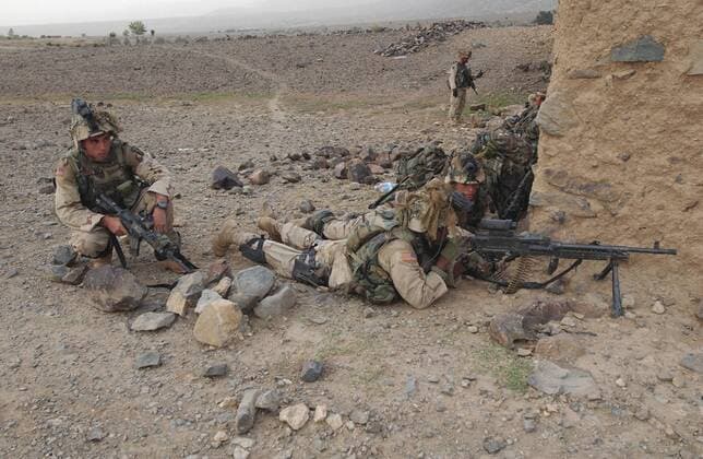 July 23, 2002 - Soldiers secure their sectors of fire and set up a 360 degree perimeter of security prior to conducting their search and attack mission in the area of Narizah, Afghanistan.  Copyright: StocktrekxImages stk100093m