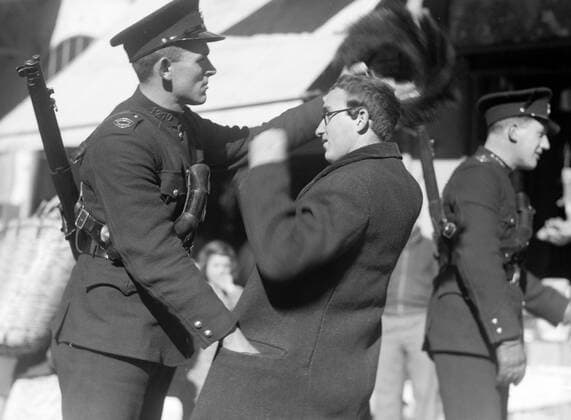 Photograph of British Mandate Police in Palestine, searching an Orthodox Jew for arms. Dated 1938 WHA  !ACHTUNG AUFNAHMEDATUM GESCHÄTZT! Copyright: WHA UnitedArchivesWHA_055_0082